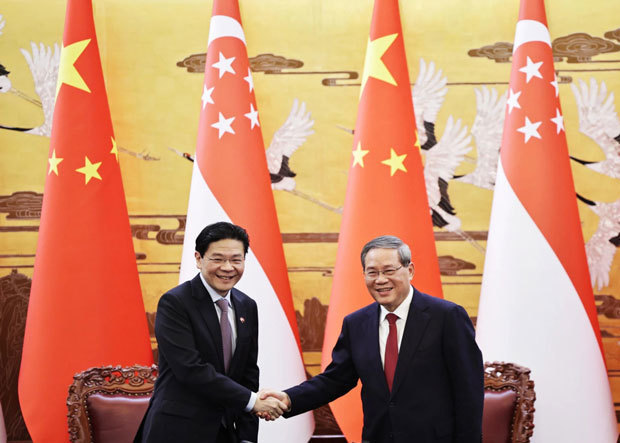 シンガポールと中国の両政府はウォン首相（左）の訪中に合わせて、人材開発など４分野で協力することで合意した（PHOTO: ST）